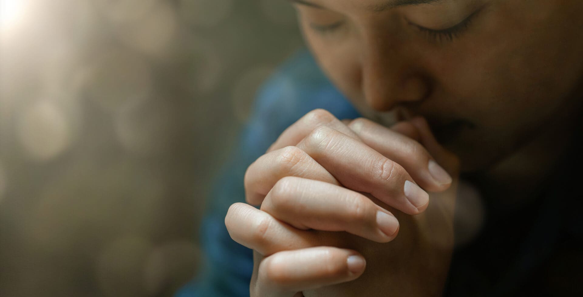 Individual in deep, reflective prayer