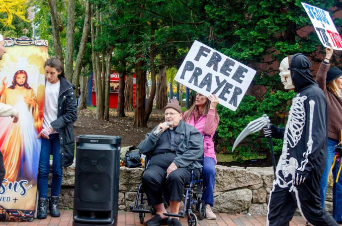 People offering free prayers in public space.